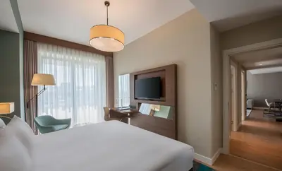 a hotel room with a bed and a television at The Superior Living Batışehir in Istanbul