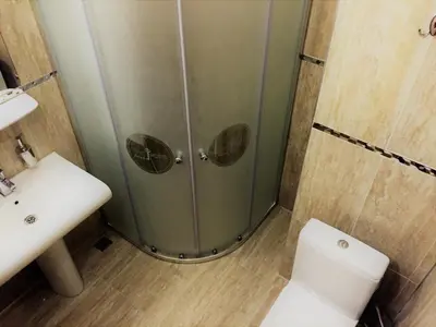 a bathroom with a shower and a toilet and a sink at Grand Park Hotel Corlu City Center Bed and Breakfast in Corlu