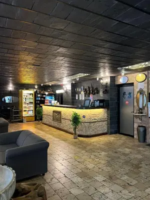 a lobby with a bar with a couch and a counter at Grand Park Hotel Corlu City Center Bed and Breakfast in Corlu