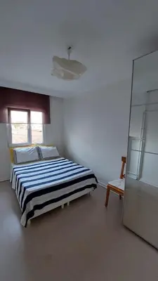 a white room with a bed and a chair at A Million Dollar View In the Heart of the City in Istanbul