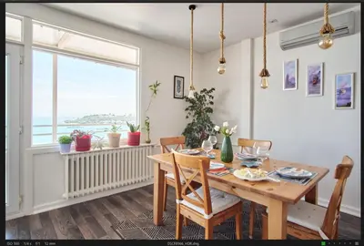 a dining room with a table and chairs and a window at A Million Dollar View In the Heart of the City in Istanbul