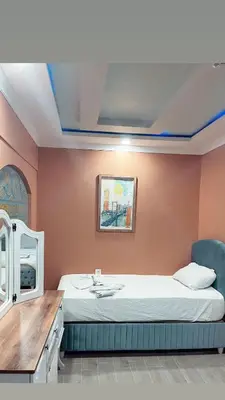 a bedroom with a bed and a sink in it at CEMRE SUIT in Istanbul