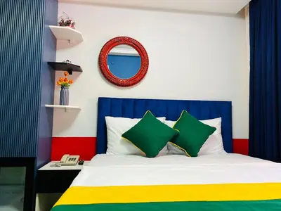 a colorful bedroom with a bed and a mirror at Apex Hotel in Istanbul