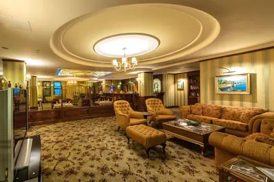 a large living room with a couch and chairs at Grand Yavuz Hotel Sultanahmet in Istanbul