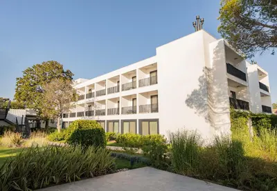 an exterior view of a white building at Pınar Otel in Erdek
