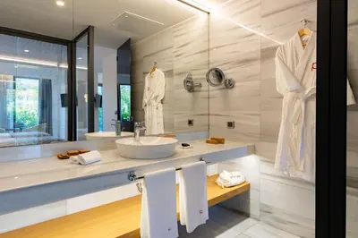 a bathroom with a sink and a mirror at Pınar Otel in Erdek
