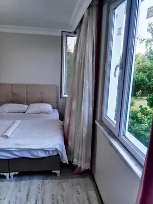 a bedroom with a bed and a window at Ahmet Teacher's villa is 6 minutes from Istanbul airport in Arnavutköy