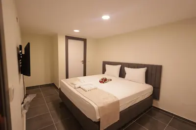 a bedroom with a large bed with flowers on it at Bonita Apart in Istanbul