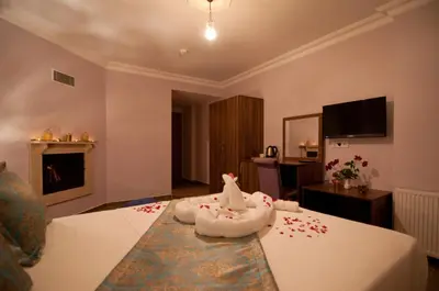 a hotel room with a bed with a unicorn on it at DEFNE OTEL in Sile