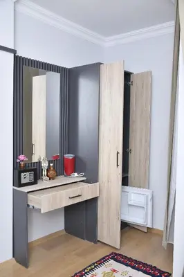 a dressing table with a mirror in a room at Hotel Arinna in Istanbul