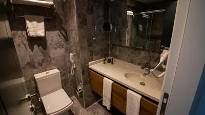 a bathroom with a toilet and a sink at Lake Life Hotel in İznik