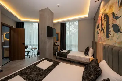 a hotel room with a bed and a tv at Comfort Point in Istanbul