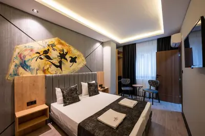 a hotel room with a bed and a painting on the wall at Comfort Point in Istanbul