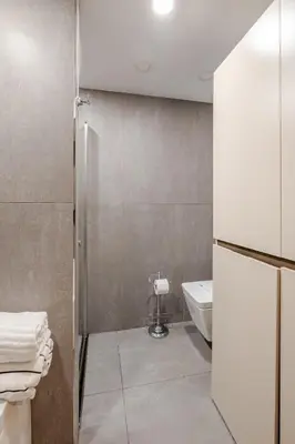 a small bathroom with a sink and a toilet at Central Istanbul, Luxury 3BR, 4 min to Metro in Istanbul