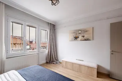a bedroom with a bed and a window at Central Istanbul, Luxury 3BR, 4 min to Metro in Istanbul