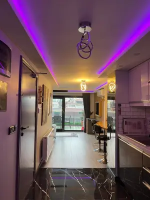 a kitchen with purple lights on the ceiling at Ortakoy Suit in Istanbul