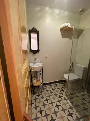 a bathroom with a sink and a toilet at Fatih Balat tarihin içinden konut - 3 in Istanbul