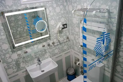 a bathroom with a sink and a mirror at NOVA PORT Boutique Hotel in Tekirdag
