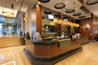 a lobby with a bar in a restaurant at Titanic Business Kartal in Istanbul