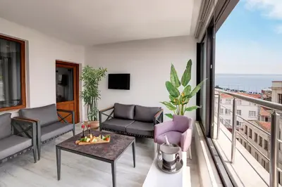 a living room with a couch and a table at Skalion Hotel in Istanbul