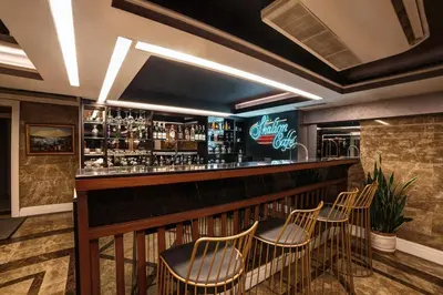 a bar at a restaurant with chairs around it at Skalion Hotel in Istanbul