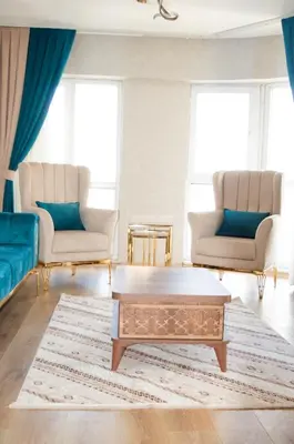 a living room with two chairs and a coffee table at King Suite AN33 in Esenyurt