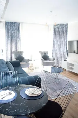 a living room with a couch and a table at King Suite TC1 in Esenyurt