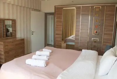 a hotel room with a bed with towels on it at King Suite TC1 in Esenyurt