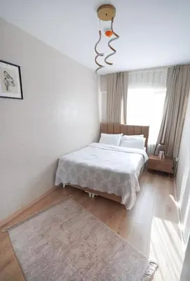 a bedroom with a white bed and a window at Luxe Suite AI3 in Esenyurt