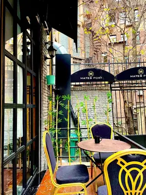 a table and chairs sitting outside of a restaurant at Mates Port Hotel in Istanbul