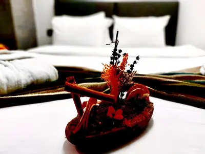 a pair of red shoes sitting on top of a bed at Mates Port Hotel in Istanbul