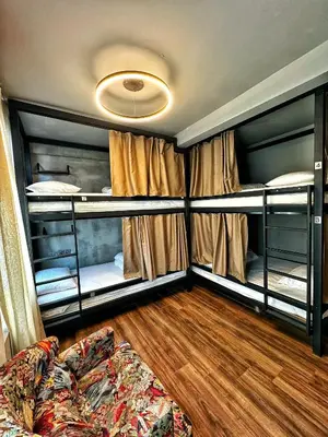 a living room with two bunk beds and a couch at Nomad Hostel Karaköy in Istanbul