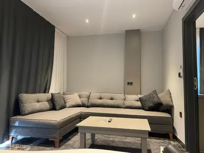 a living room with a couch and a coffee table at CK Boutique Hotel in Istanbul