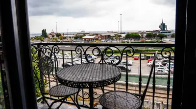 a table on a balcony with a view of a parking lot at CK Boutique Hotel in Istanbul