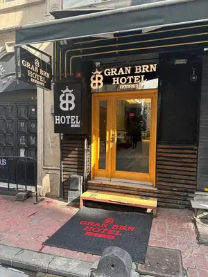 a store front of a green bin hotel on a street at Gran Brn Hotel Taksim in Istanbul