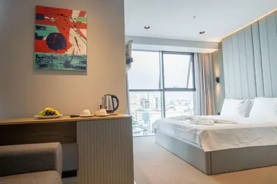 a hotel room with a bed and a large window at SHERLOCK HOMES HOTELS in Istanbul
