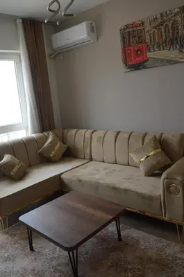 a living room with a couch and a coffee table at Classic Suite MS34 in Istanbul