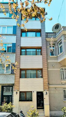 a tall building with many windows in front of it at Cihangir Flat in Istanbul