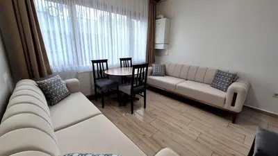 a living room with a couch and a table at Cihangir Flat in Istanbul