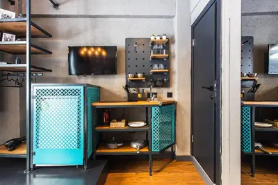 a room with blue shelves and a wall at Mansion Gorki in Istanbul