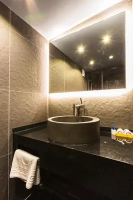 a bathroom with a sink and a mirror at Mansion Gorki in Istanbul