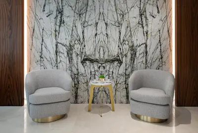 two chairs and a table in a room at Gleam Collection Hotel in Istanbul