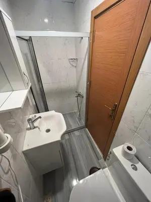 a bathroom with a toilet and a sink and a shower at GRAND Deniz Hotel in Istanbul