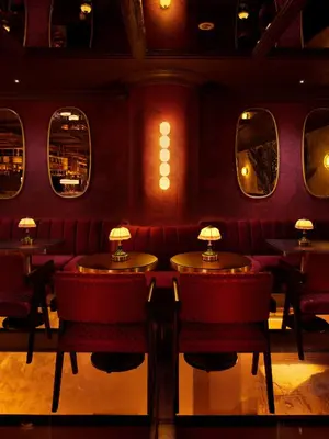 a restaurant with red chairs and tables and mirrors at Shining Star Hotel in Istanbul