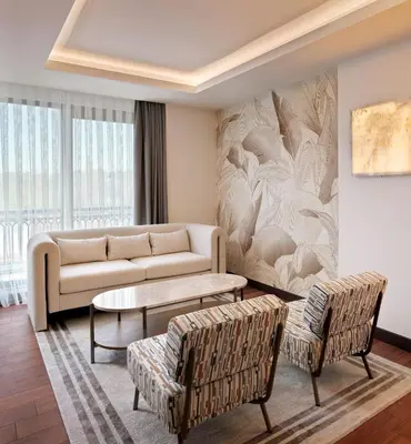 a living room with a couch and chairs at Shining Star Hotel in Istanbul
