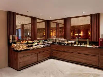 a buffet line in a restaurant with food on display at Shining Star Hotel in Istanbul