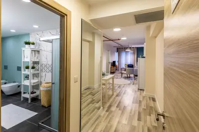 a door leading to a hallway with a living room at Monnas Suite in Istanbul