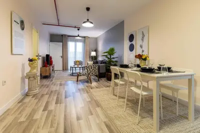 a living room with a table and a dining room at Monnas Suite in Istanbul