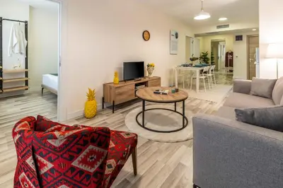 a living room with a couch and a table at Monnas Suite in Istanbul