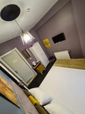 a bedroom with a bed and a large mirror at Retro Suites in Istanbul